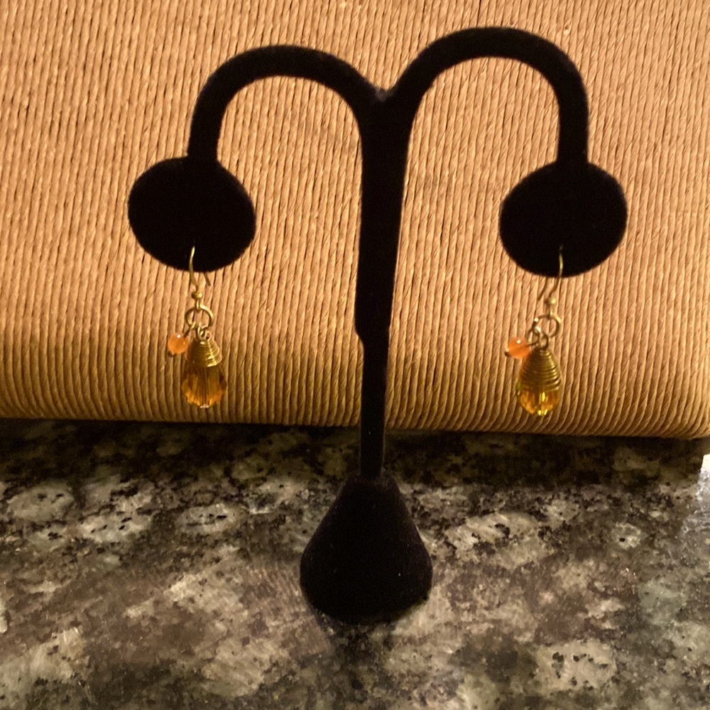 Citrine teardrop faceted bead with small coral bead pierced earrings.
